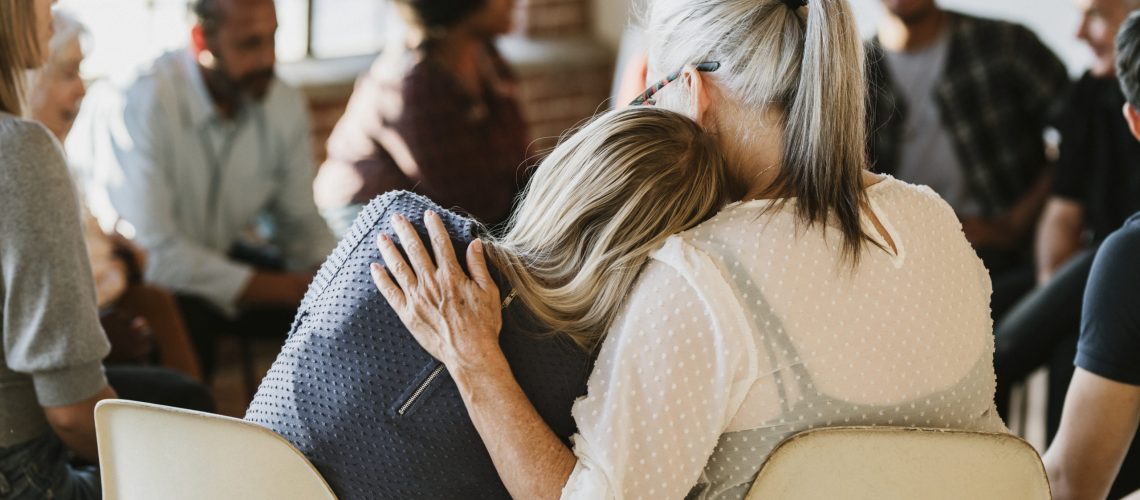 People support each other in a rehab session